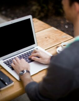 Photo by Alejandro Escamilla man in front of laptop computer in shallow focus photography
